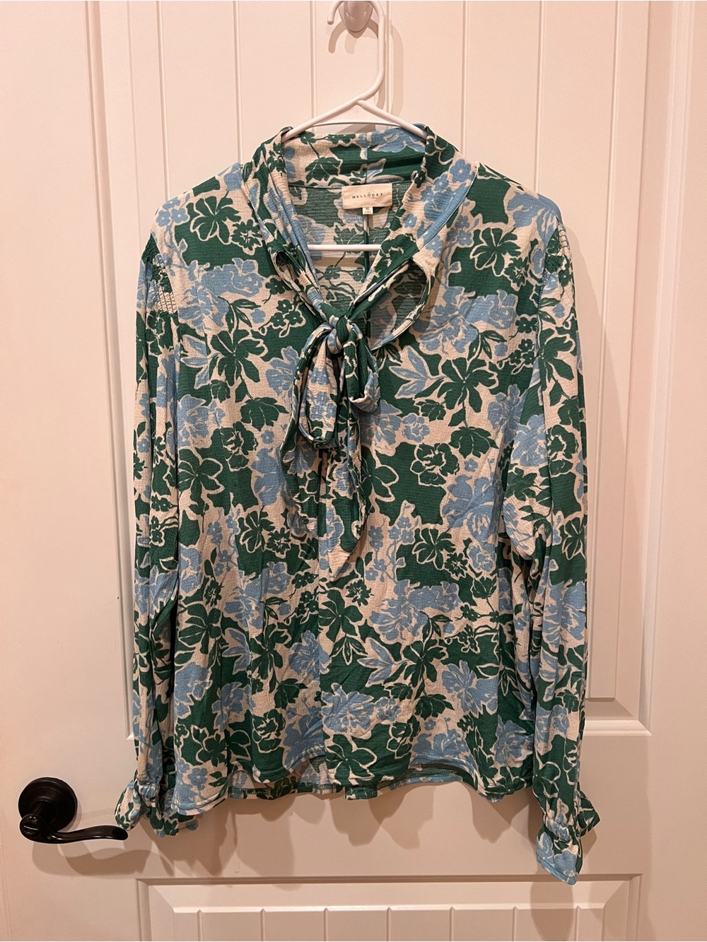 Floral blouse with bow tie neck top.  Blue & green floral print